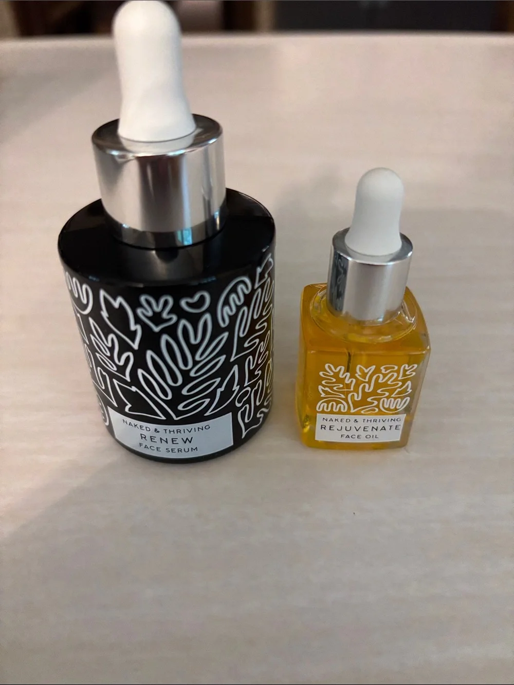 Naked & Thriving Renew Face Serum & small bottle of Naked & Thriving Rejuvenate
